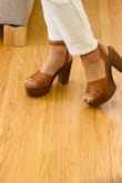 OMG! These sandals are so lightweight!! I was afraid that they were going to be heavy because they look kind of bulky, but they are not!!! I wear high heels for special occasions only, so I'm not used to them. Anyway, I wore them for almost 6 hours and my feet were perfectly fine.
I ordered my regular 7 size and they fit true size. - Erica V.