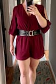 This wasn't super flattering on me. I needed a Large to accommodate my butt, but then the blousy top was too loose, and yes, there is a snap to hold the top closed, which was necessary. The shape was too square for me. Wearing a belt helped nip in the waist but made the shorts ride up too much. I did like the sleeves and felt this could be styled to look quite sophisticated. The open sleeves made getting in & out of this jumpsuit a little extra tricky. - Ja R.