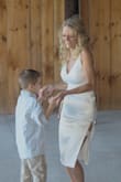I wear this as a second dress for my wedding. Fit perfect. I would definitely purchase another dress from this company. Very well made and just stunning! - Joy M.