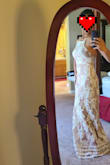 Loved this dress. Much heavier in weight than I expected. Quality is really nice. Recieved a number of compliments from the streamstresses I visited for quotes. Adjustable straps help fit the bust area so no alterations needed there. Will be buying 3-4 inch heels so I think I can get away with the length as well without alterations. Was looking for a gown to renew our vows in. Loved everything about this dress but thought the slit was too high. Alterations has quoted $15 to $20 to close the slit down about 2 inches which seemed to be a quick and relatively inexpensive fix. Looks bridal enough without being a wedding dress. Feel like I can wear it again to a different event without looking like a bride. - Jacqueline E.
