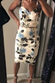 This dress is beautiful&I am a true XS that can sometimes wear a small due to athletic build, and the XS fit perfectly. So many compliments and the embroidery and embellishments took this dress to another level. Highly recommend! - Tandra L.