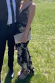 Wore this to a wedding. It fit like a glove, but apparently, you can't do anything except stand and look pretty because the moment I bent over a tiny bit it tore. It wasn't even tight in the butt area! I had no idea until a guest informed me of the rip. Luckily there is a slip under so your butt won't show... but still extremely embarrassing and disappointing. It then began to unravel and was in shreds by the end of the night. - Morgan P.