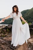 This dress is absolutely beautiful. It's flattering in every way. I wore it for our engagement photos and it was a hit all around! I definitely recommend it! - Dana G.