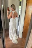 This is my second wedding and I didn't need a huge gown, so this is the perfect middle ground. It's super comfortable, thick material, easy to put on and take off, and has a cute open back. It had good reviews and I agree! I love this dress. I need to lose my belly pooch, but other than that, it fits perfectly. - Jessica M.
