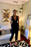 This jumpsuit can be worn a multitude of ways depending on how you tie it. I have a very long torso and it totally fit. Was going to use some booby tape, but honestly, it kept my 34B girls in place without it. I have a small waist and wide hips/thighs and it made the best of both. Do yourself a favor and get it.. - Amanda B.