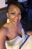 Fits great! Pants too long even with heels. Had to get hemmed. Great fabric quality. I lost a few pounds after it was hemmed. However, I think a small would've been too snug. - Bonita D.
