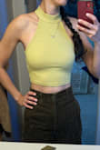 This top is very cute and comfy (the collar doesn't choke you like some turtlenecks). My only concern is that it's a very thin material and you can see the silicon petals I put on to hide my nipples through the top. If you have bigger petals that cover the whole breast, that's probably the best way to wear this. - Divya M.