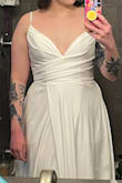 It's a nice dress, but not flattering on smaller busts. I'm 5'6" and the length was pretty long, so it would need to be hemmed. The dress was lined but you could still see the pockets. I ended up returning it. - Jasmine H.