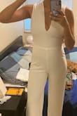 I bought this for my wedding reception. The jumpsuit material was not what I expected for the price, it was slightly see-through/cheap looking. The fit (my measurements 36-28-38) was a tiny bit big but still wearable. The criss-cross back is very beautiful though. I ended up returning the item.

Canadian buyers beware - I returned two jumpsuits and the shipment was about $100, which Lulus does not reimburse you for. Overall, I was very disappointed. - Keepa K.