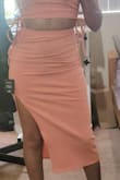 This dress looks just like in the picture. But the fabric does not really stretch, so it fits tight. My belly shows, but i guess that was expected with this type of fabric. Length is ok, a little longer than expected. I cannot return bc it was a final sale. I'll have to work out a little before wearing it. - Teresa M.