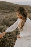 This dress was perfect for our engagement photos. It does run pretty long. I usually wear a M size, but the S worked out fine. The material is overall nice and a little see through getting the white color. The chest part was a little low cut, so I added a safety pin. - Jennifer N.