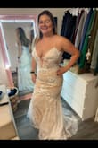 I loved this dress. Really looks good on someone with curves. This dress really wouldn't have required very many alterations for me personally! I returned because it showed off a little more cleavage than I was willing to show on my wedding day ;) - Alix M.