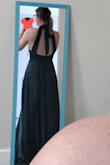 I love it! It fits very well and the fabric is very nice! It's a stretchy sort of satin so it's quite comfortable. The back is beautiful! The only issues are minor. It's too long which is expected for a formal dress. Also the bust has a bit too much fabric which surprised me because I'm well endowed. Nothing a tailor can't fix. Anyways I'm very happy and impressed especially at the price point. Love it!
Also the pictures make it look more blue but it is definitely more emerald. Don't fret. Oh and sorry for the dust on the mirror! - Holly Y.