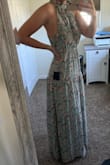 I was hesitant on what size to order because of other reviews. Very glad I stuck with my normal medium and didn't size up to a large. This fits like any other maxi dress would and has a stretchy waistband. For reference I wear size 8 in jeans and normally small/medium in tops. I love the Sage green and pink mix and plan to wear to bridal showers and rehearsal dinners. - Shelby Y.