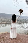 I wore this dress for our Winter Wedding day and it was perfect! Classy with the right amount of =	 with the front slit and low lace back. - Maia P.