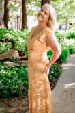 I've always wanted a long, yellow dress that's flowy and fun to wear. This one checks all the boxes. I am a curvy, short chick (not a rail like the model - but that's why she's a model). I was able to wear this without a bra - it has an open back. The front held the girls in, and mostly up - with occasional adjustments. At 5'3, I definitely had to have it shortened. It puddled on the floor before I did, and that was with heels on. It was a touch tight across the top (to be expected with my chest size) and hip (also to be expected because of my hip size), but if I'd gone up a size, it would have been too big all the way around. I was able to move in it easily, not restricting anywhere, and it was so garden-party chic that I was turning heads at the restaurant for my birthday. It's just a fun, chiffon-flowy dress to wear, and you feel stunning. Multiple compliments from strangers. Thanks for making me feel beautiful at 37, Lulus! - Caroline M.