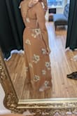 Once I figured out how to tie a wrap dress after a quick google search, the dress overall fit me pretty well. The problem is the bust. I'm not even THAT big on top, only 34D, but if you're this size or larger, I would skip this dress. I really liked it so I took it to be hemmed which is an inexpensive, quick fix. What I didn't anticipate was the saga on top. Once I realized that I couldn't wear a bra with this, I asked a seamstress to also sew non-padded cups in for a *little* support & structure. I guess chicken cutlets or those new boombas could also work. But either way, I still felt so exposed with far too much cleavage so then I had her add two hooks to the front to pull it together. I'm a little worried about dancing in this, hoping it doesn't pop open. But I've come this far with altering it so I'm going to wear it! I'll bring a little jacket with me in case something pops and hope for the best. Basically, if you're smaller on top, go for it! If not, look for something else and avoid the hassle. - Jennifer C.