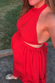 Sized up to a medium. 27 weeks pregnant in this picture. It seems like it will easily fit my whole pregnancy and also be cute and roomy afterward
Would buy in a small normally. Great fit. Very flattering. Airy and light. I didn't find there to be too much fabric. Was wearing in Italy in very hot summer weather and was comfortable - Jillian M.