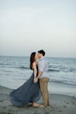 This dress is so so beautiful and well made, I can't say it enough! The color, style and flow of it is so flattering and I felt beautiful wearing it for my engagement photos. It has a lot of fabric on the bottom, but it was not too heavy (until I got in the water and I had to carry the bottom of my dress in order to walk haha). It fit me perfectly and has the crossed back which makes it easy to adjust to your size. Don't think, just buy this dress! - Rachel F.