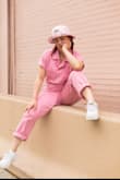 My friends and I love being creative & creating content -- anything from IG, to TikTok to our own personal photography & modeling. So, when I saw this adorable pink utility jumpsuit, I knew I had to get it & create a photoshoot around it. It's such the perfect mix of feminine & masculine & hugs the body in the best ways possible. It's also totally functional -- so whether you're showing it off for a photoshoot like my friend group did, or are using it for something like volunteering, a day shopping, or moving into a new space, it's literally perfect for everything. It has pockets, comfortable material, & is also easy to style. We took a bunch of different photos with different accessories -- high heels vs. sneakers, hat vs. hair up, necklaces & bracelets vs. no jewelry, & more. This was actually personally my first time shopping with Lulus, & because of this high-quality, functional, comfortable, breathable, and stylish product (with amazing on-photo results!) I'll shop here again. Love it - def get it! - Annabelle S.