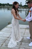 I ordered a small and it fit like a glove. It was easy to move around in and was super flattering. Looks just like the photos. This was the perfect dress for my elopement. I did get some spanks to make sure my underwear and leg tattoos didn't show through, because in full sun you can see a little if you are wearing something dark. It has a nude slip and gives the 'nude' look under the lace. I also got one of those stick-on bras so I wouldn't have any straps. This dress was classy, modest, flattering, and elegant. It got a lot of compliments, and I liked that it has a little bit of a train in the back. Very high quality, I felt like I got sooo much for what I paid. My budget was smaller, but you wouldn't know with this dress! - Becky C.