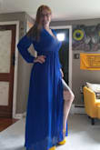 Fits better than I anticipated. Definitely a sexy slit for the leg. Thicker material than what I thought, but it would be good for a fall wedding. a wee bit too warm for the summer. - Angela C.