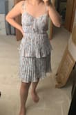 Extra fabric near ribcage isn't bad for smaller busts with correct size. But the length is a no-go for people under 5'5. I felt like a Christmas tree. You'll either have to get it hemmed or remove the bottom layer like I did. - Kaoshoua T.