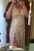 I got married last fall and I didn't know what I really wanted. I ordered this on a whim because I just wanted to try it on. And I'm glad I did because it turned out to be the one.

I will say, at 6'3" the bodysuit had no chance of fitting me. I removed the bottom of the bodysuit and wore a slip. But the hassle to make this dress work for me is well worth it. The lace is beautiful. It's slightly non-traditional and a little edgy while still feeling bridal. The back is beautiful. After 5 dress potentials, this is the first one my mom, sister, and very picky friends all went hot damn. This is an XL. - Kirsten O.