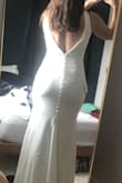 I just couldn't rationalize paying hundreds and even thousands for a dress I was going to wear one night, so I took a chance on this and love it! I would go as far as saying it's my favorite that I have tried on... maybe it's the price, but this is a godsend when you're looking to cut cost for your wedding. Excuse the messy room. - Amanda C.