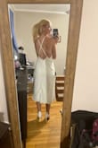 Fit perfectly! Has thick fabric underneath (not at all see-through thankfully) so it might look a little bigger but fits snug, and realistic to size. Wore for a backyard wedding. - Megan C.
