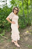 I loved the dress and the color. It fit beautifully. I ordered it for my birthday party. I am a size medium normally and ordered a large as I read it runs small. I'm glad I did that as the Large size fit just fine. I did add an undershirt as the neck runs low. - GLADYS R.