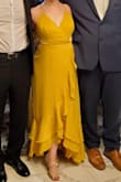 Beautiful dress and a very flattering cut. I am right between XS and S right now, so I ordered the XS and it worked. I think the S probably would have been fine too. I wore it to my friend's July wedding and got told I looked like Belle! ::childhood fantasy - complete!::  The bust runs large, but I figured out a way to hack it. I wore chicken cutlets, used boob tape and a safety pin in front to ensure no gaps, AND I had my partner tie a knot in the highest fabric loop on both the right and left sides in the back, at just the right length, before continuing to lace the rest of the loops below. It worked perfectly! The boob area never got saggy. Also, I used the "steam" setting on a hotel iron to steam the dress while it was hanging up and that worked perfectly to remove wrinkles. Highly recommend this dress! Unfortunately, the photo uploader kept turning my photo sideways no matter if I saved it rotated to compensate. Sorry, the pics are goofy. - Maria P.