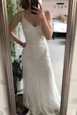 Lovely dress! It fits like a glove on me, is comfortable, and good quality. I was concerned that I wouldn't be able to move well in this since it is a "fit and flare", but the material is stretchy enough around the hips to move well in. Beautiful beaded design as well. I will be happily wearing this for my August wedding! - Kellan G.