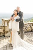 Wore this for my intimate wedding ceremony. So many compliments. Beautiful and comfortable. Had it hemmed and also took the advice of other reviewers and had the lining sewn to the dress around the split. So very pleased with this purchase! - Michelle P.
