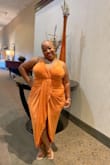 I wore this dress to a wedding and I received soo many compliments. The color is amazing shows just as bright as the picture. 
I could have sized down because the dress has so much stretch in it. I got an XL and could have gotten a L 
I did have to pin the bust because my bra was showing.  It was a show stopper for sure. - JaNae W.
