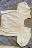 I'm always a medium and it fits great. It's not too cropped which is great as well. The color is the same and it's super soft. - Ying B.