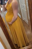 I bought this dress in both the green and yellow. Both fit amazing! Comfortable and non restrictive on my belly. It's hard to find a dress during pregnancy thats both bump friendly and very flattering! I also love that the straps are easily adjustable and the clasp is sewn on very well for durability. I would recommend this dress for both pregnant and non pregnant women - Suze V.