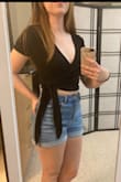 Love this top. The material is soft and the wrap makes it easy to adjust for your preferred amount of cleavage. Only complaint is that the ties are longer than they need to be. Still cute, just too much fabric on the ties. - Deanna M.