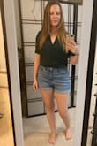 Fits pretty loosely on me, but I think that's how it's supposed to be worn. Material is light but not flimsy feeling. Color is lovely and the neckline is flattering without being too revealing. Overall love it. - Deanna M.