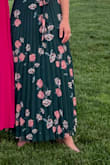 I love the way this dress hangs. The floral pattern was perfect for the event. The detailing with the back tie, ruffle sleeve detail, and center buttons were wonderful.  Skirt hangs and flows, And allows you to still feel comfortable if you eat a big dinner.  I had many compliments. - Elizabeth E.