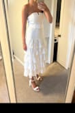 I purchased this dress for my bridal shower in September and I really love it! Just needs a quick steam, otherwise, it's exactly what I was looking for. The dress itself is a great material. Lightweight, comfortable and flattering. Can't wait to wear it next month! - Leanne L.