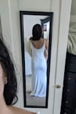 The dress is plain and simple! Figure-hugging and not forgiving would be hard to wear with shapewear. Not for me, might look nice with a belt or accessories. I am between size 4-6 and went with a medium. - Adriana C.