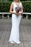 This is a lovely dress - made of nice material and not see-through. I wanted a simple dress without a train and couldn't find any in the bridal shops. This ended up saving me a lot of money as it was pretty perfect. I found the waist sat a little high on me so I got a seamstress to add in a 2" waistband with a belt - overall alterations weren't too expensive and I think it worked out perfectly. - Ruth R.