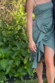 This dress was perfect for me!! Fit so flattering and got so many compliments at the wedding I wore it to. The ruching is a good way to hide any bloating that may happen from enjoying all the delicious food and drinks we consumed all night. It also holds up well against sweat. It was an outdoor ceremony (95 and sunny) and no sweat stains in undesirable areas. Can't wait to wear it again! - Vanessa P.