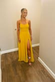 Stunning dress, wore to a wedding and I received many compliments. The color is more beautiful in person. Alterations were done since the the length was long even with heels. - Johana O.