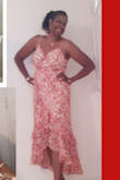 I bought one dress for my mom, and one for myself. I purchased an XL,  the fit runs small, we are very curvy women. The dress is lined and very long in the back. I'm 5'6" Without heels the back touches the floor. The dress is absolutely beautiful and very comfortable. I would suggest if you are very curvy go up one size.
Adding my mother's picture in this beautiful dress on her 72nd Birthday. - MICHELLE B.