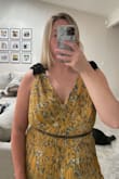 Bought this dress to wear to a black tie optional wedding. I am typically a M/L on top and L/XL on bottom and the large in this dress fit perfectly throughout my waist/hips! Top part is a little bit but should be an easy alteration. Quality is great & it's a flattering dress. - Reagan P.