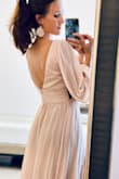 I like this dress and I will use as a bridesmaid for my sister's wedding, but it's not what I had imagined. The waistline is almost empire and a little big for me. The fabric is very light and airy, and yet there is so much of it that it feels bulky. It is also a much paler pink than in the advertised photo. I do like the neckline and back line though. Very elegant! - Joy M.