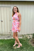 I purchased this dress for my sister in laws wedding shower. It was really cute and I got a lot of compliments. The fit was a little tight in the bust and a little short for me, but I have really long legs. I probably would have purchased a medium just to feel a little more covered. - Julia R.