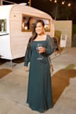 This dress ran true to size for me. I ordered the same dress in a different color a few months before and I loved it so I had to get another one. I got a large in my burgundy dress and it fit just right. In my green one, I ordered an XL and had to alter the length a bit but I liked how I was able to lift the sleeve to cover my shoulder since it was a little big. - MELANIE A.